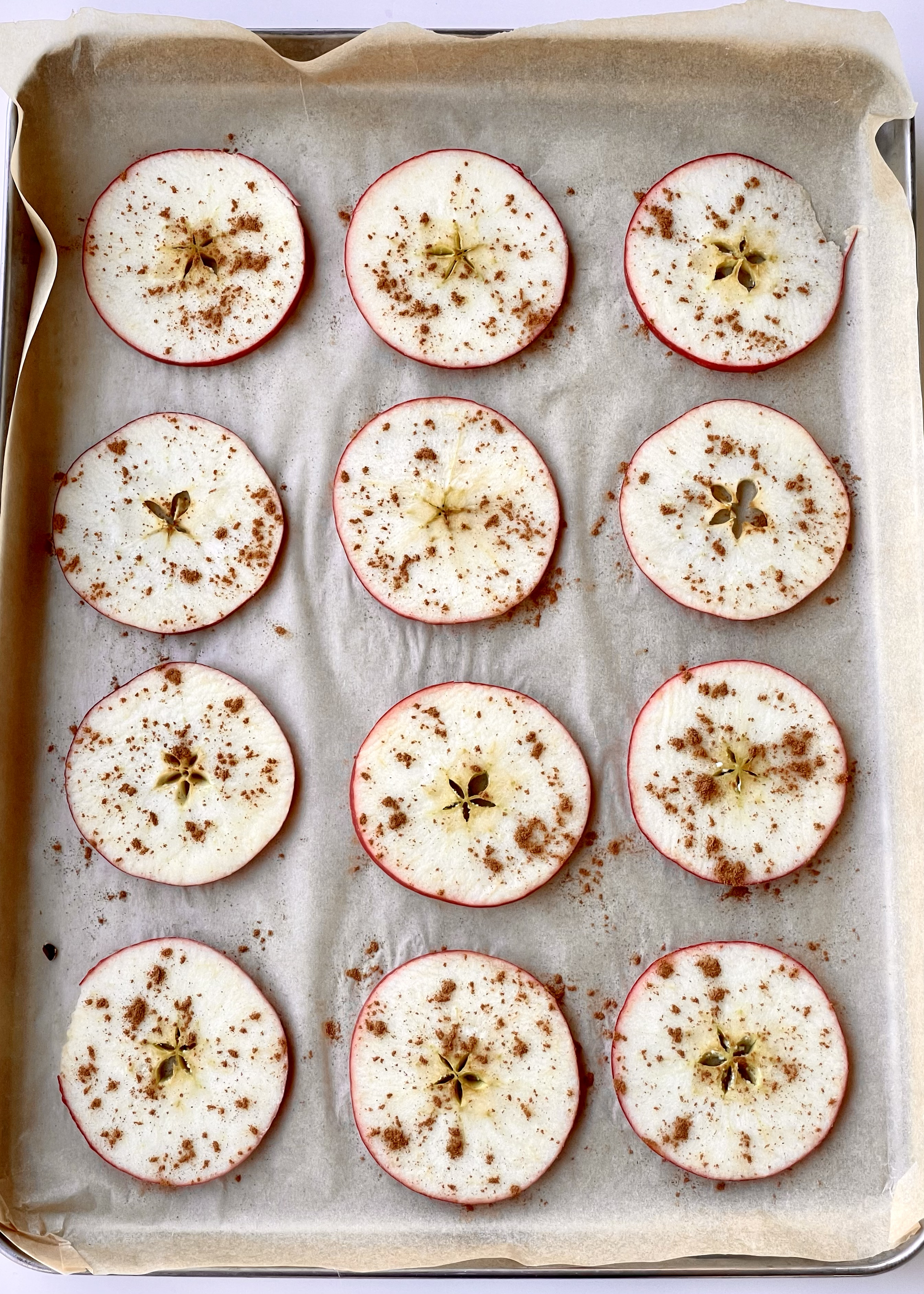 Cinnamon apples on a baking sheet